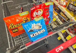 Hershey's, Kit Kat, and Reese's chocolate share size bags inside shopping cart