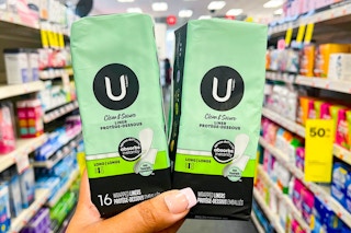 hand holding two U by Kotex liners