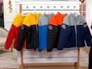 NFL jackets on a rack 