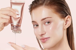 a woman using a medicube mask