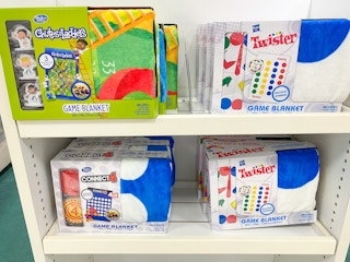 a display of hasbro game blankets on a shelf