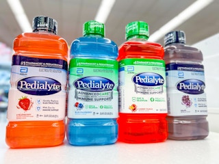 four pedialyte bottles