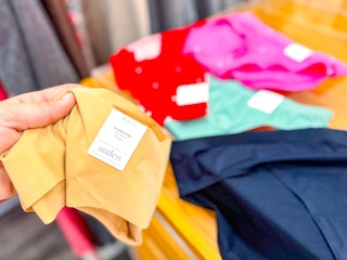 hand holding a pair of auden women's invisible edge undies at target