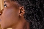 a woman wearing butterfly earrings