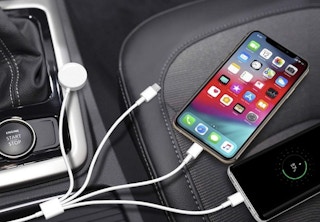 4-in-1 charger in car plugged into multiple devices