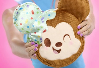 person holding a Disney Munchling