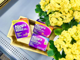 three boxes of allegra allergy relief in tray on walmart shelf