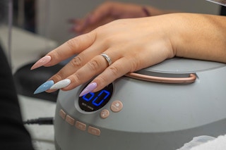 Hand with acrylics on