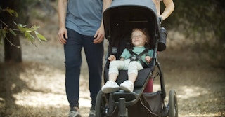 Toddler sitting in UPPAbaby Ridge Stroller, which has been recalled in 2022