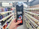 hand holding axe shampoo in walgreens
