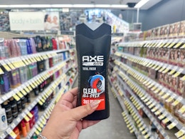 hand holding axe shampoo in walgreens