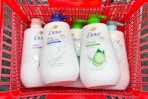 dove body wash pumps in a red shopping basket