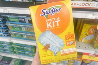 hand holding a swiffer duster starter kit at meijer