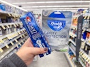 hand holding crest and oral-b products in walgreens