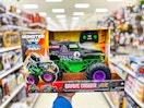 hand holding a monster jam grave digger rc in a target aisle