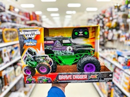 hand holding a monster jam grave digger rc in a target aisle