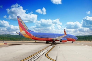 Southwest airlines flight on a runway in Hawaii.