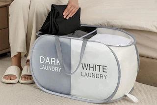a woman using a laundry hamper