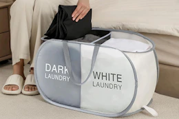 a woman using a laundry hamper