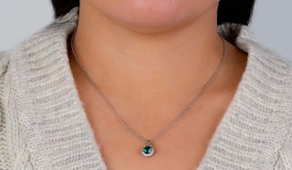 a woman wearing a crystal necklace