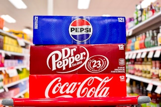 3 soda 12-packs sitting on a target cart
