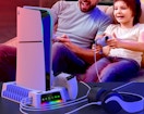 two people playing a PS5 