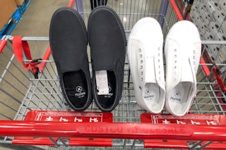 2 pairs of slip on shoes in a costco cart
