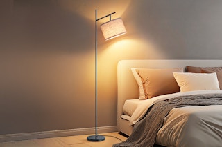 floor lamp over a bed