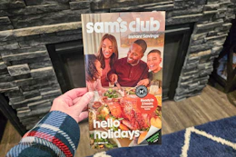 hand holding sams club nov 2026 instant savings book