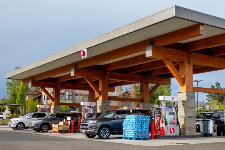 Safeway gas station with vehicles parked for fueling