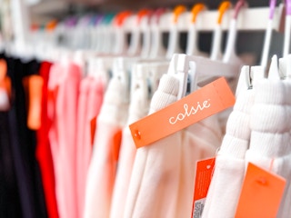 The Colsie logo on an orange tag with jogger pants