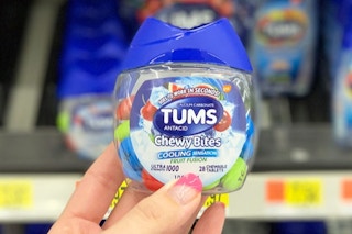 person holding Tums Chewy Bites in hand