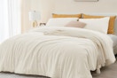 beige comforter on bed