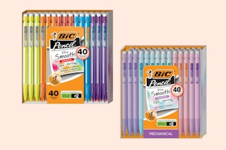 a hand holding a pack of mechanical pastel pencils in a store buggy