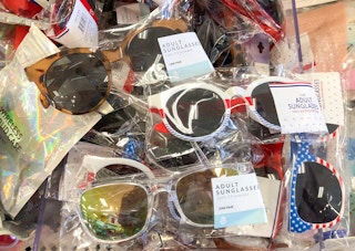 pile of sunglasses in plastic packages