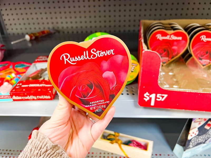 hand holding russell stover heart candy gift box at walmart