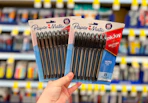 hand holding two packs of paper mate pens