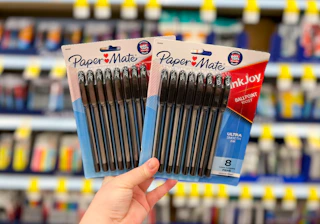 hand holding two packs of paper mate pens