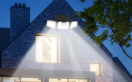 a flood light above a window in a house