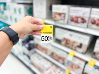 hand holding 50% off clearance tag at target
