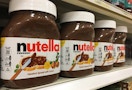 a row of Nutella jars on a shelf