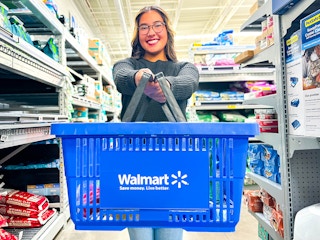 person holding a Walmart basket