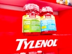 Two Proactive Support bottles over Tylenol sign on a display in Walmart store