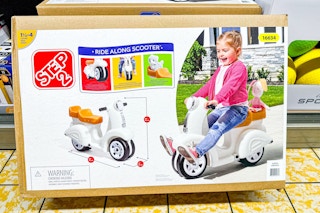 aldi step2 ride along scooter on sale floor in package