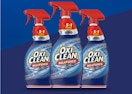 three spray bottles on a blue background