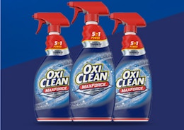 three spray bottles on a blue background