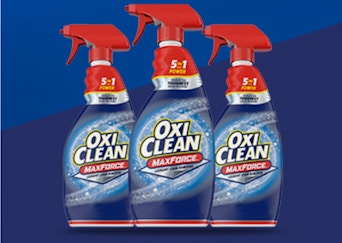 three spray bottles on a blue background