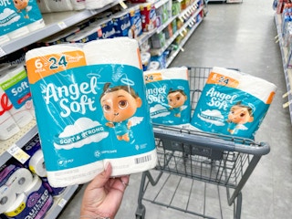 hand holding angel soft toilet paper in walgreens