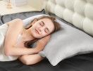 a person sleeping on a light grey silk pillowcase 