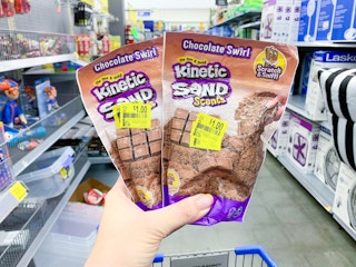 two bags of kinetic sand scents in center of walmart aisle
